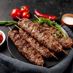 Grilled,Lula,Kebab,On,Skewers,With,Spices,In,A,Black Chicken Gilafi Kebab